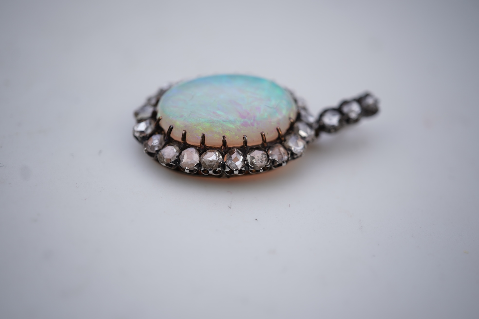 An opal and diamond pendant, early 20th century